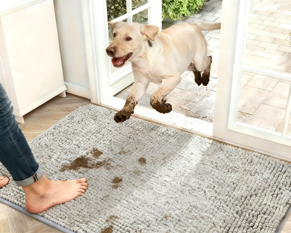 Dog running in from the garden onto a grey chenille mat by the door